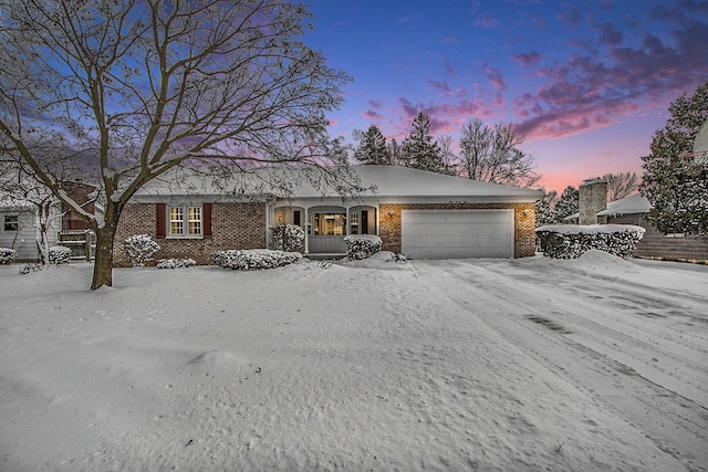 single story home with a garage