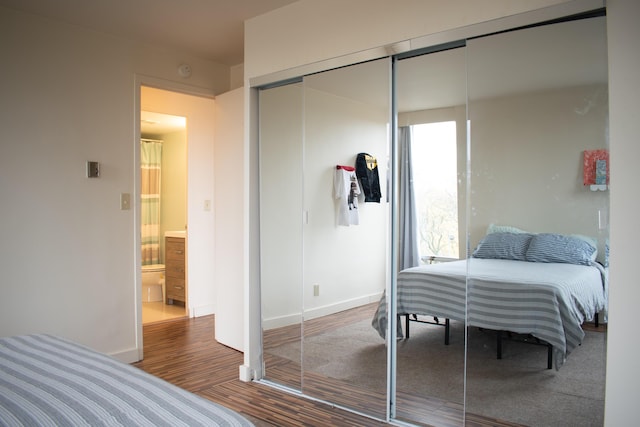 bedroom featuring a closet and hardwood / wood-style flooring