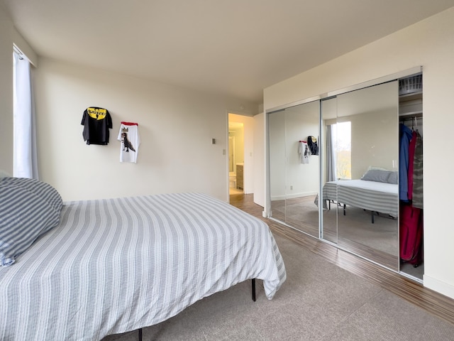 bedroom featuring hardwood / wood-style flooring and a closet