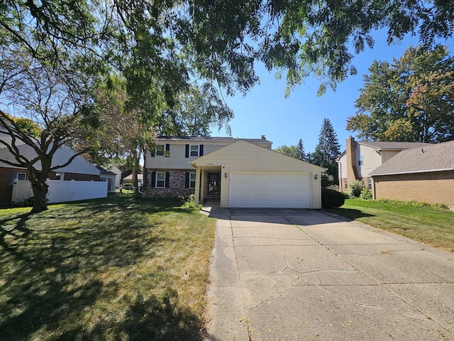 view of front of house featuring a garage and a front lawn