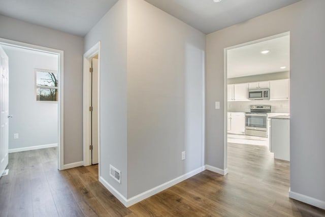 hall with light hardwood / wood-style flooring