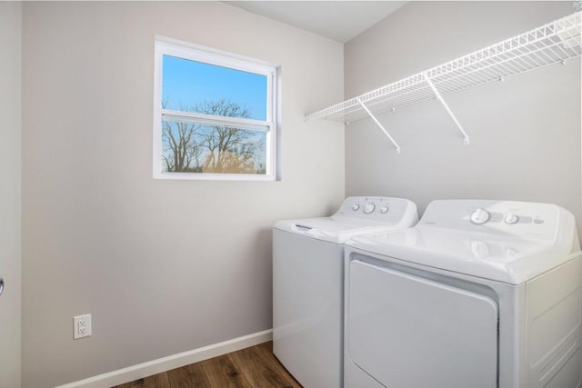 washroom with separate washer and dryer and dark wood-type flooring