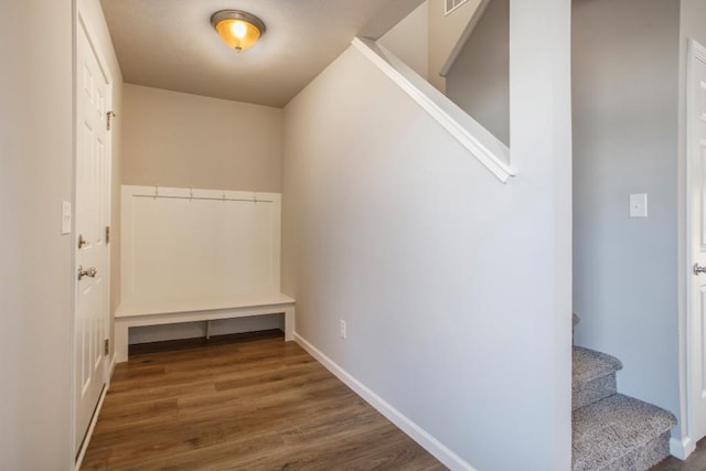 hallway with dark hardwood / wood-style floors