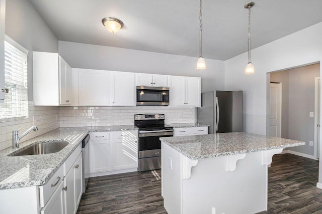 kitchen with white cabinetry, sink, and stainless steel appliances