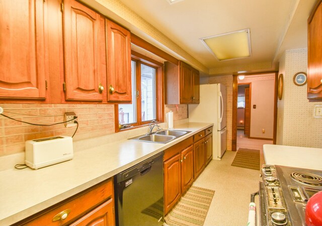 kitchen with decorative backsplash, stove, sink, dishwasher, and white fridge