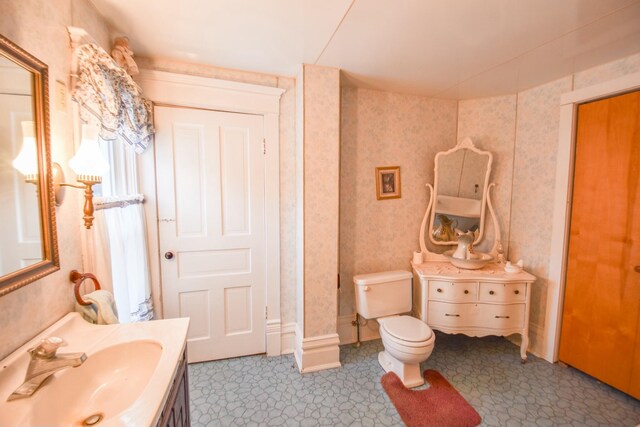 bathroom with vanity and toilet