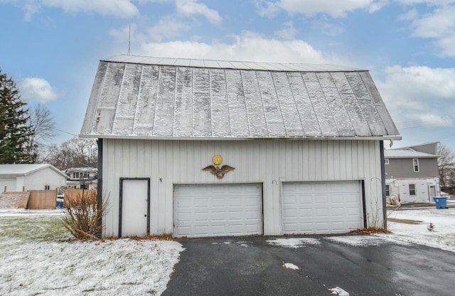 view of snow covered garage