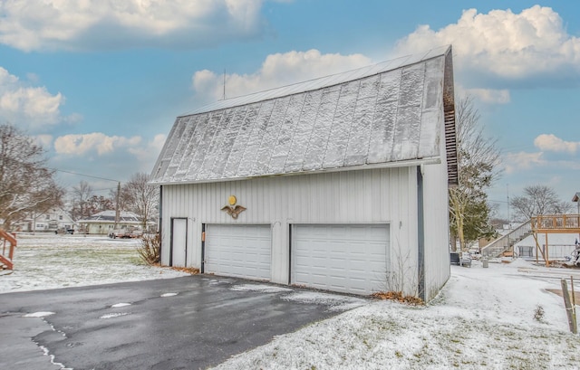 view of snow covered garage