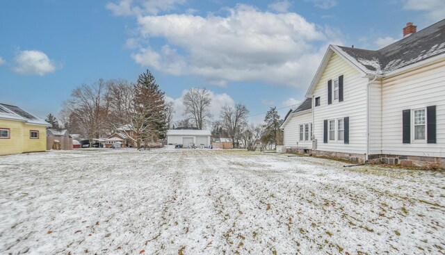 view of yard covered in snow