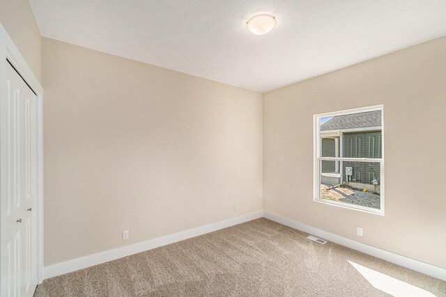 view of carpeted spare room