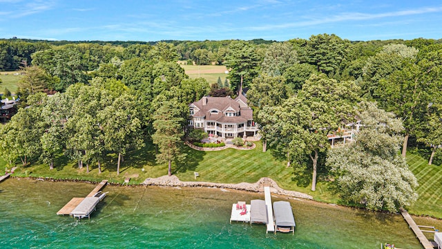 birds eye view of property featuring a water view and a rural view