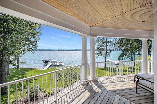 wooden terrace with a water view