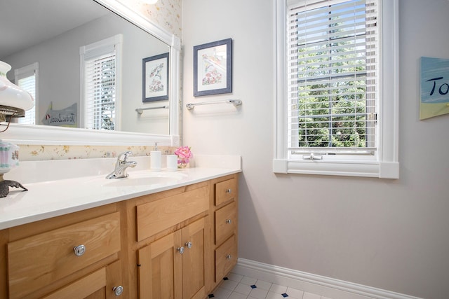 bathroom featuring tile patterned floors and vanity