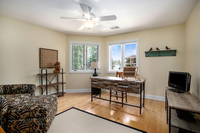 home office featuring ceiling fan and light wood-type flooring