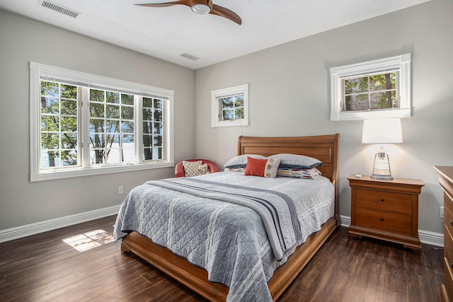 bedroom with dark wood-type flooring and ceiling fan