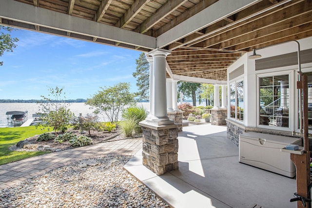 view of patio featuring a water view