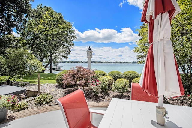 view of patio / terrace with a water view