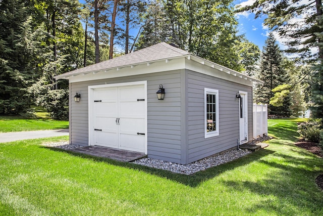 garage featuring a lawn