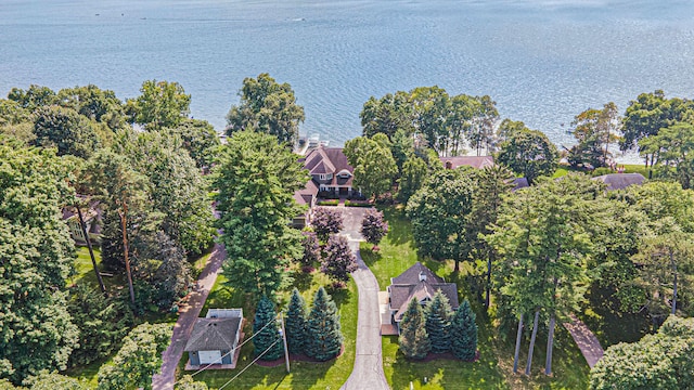 birds eye view of property with a water view