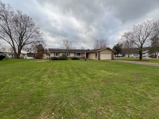 ranch-style house featuring a garage and a front lawn