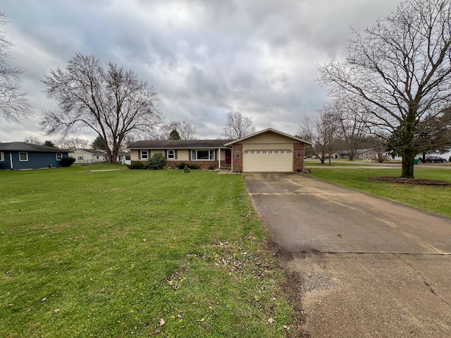 single story home with a front lawn and a garage