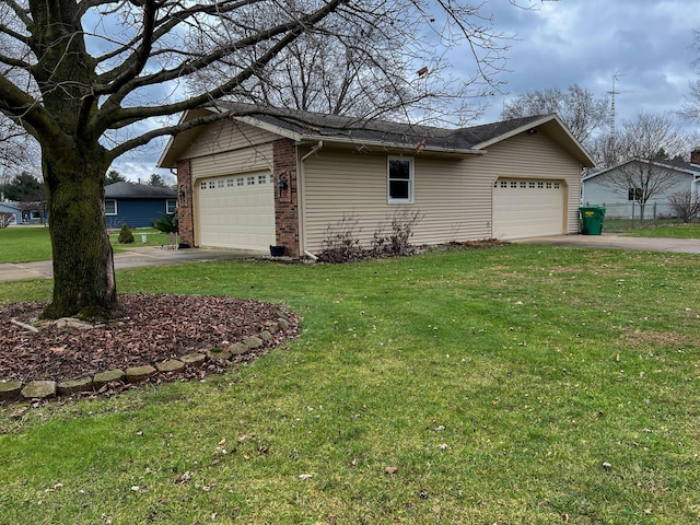 view of property exterior featuring a garage and a lawn