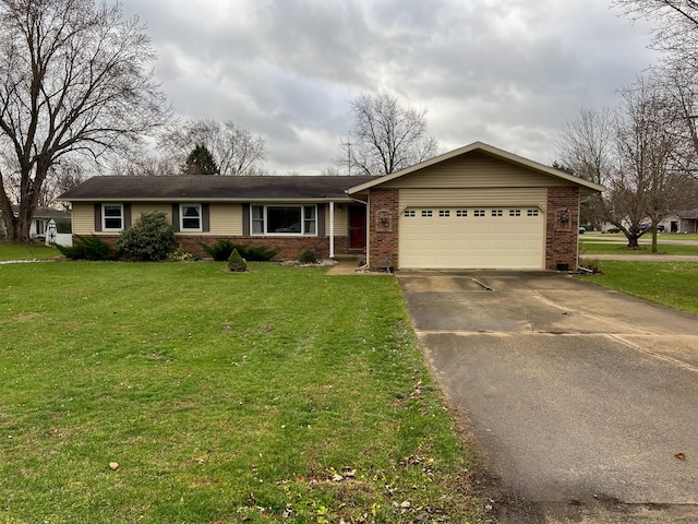 ranch-style home with a garage and a front lawn