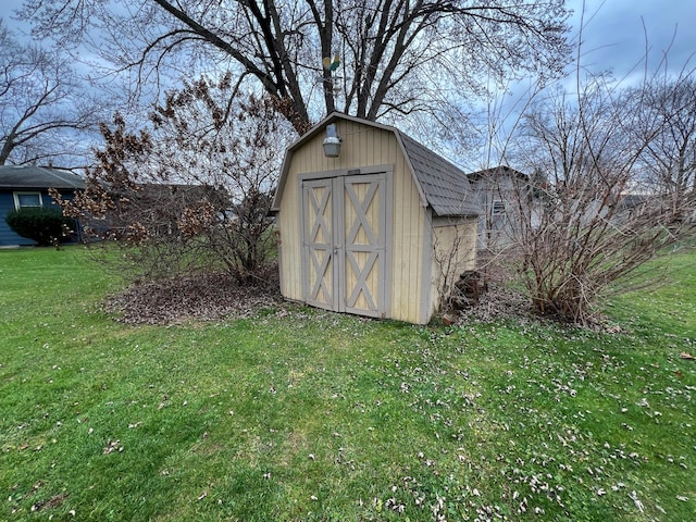 view of outdoor structure with a lawn