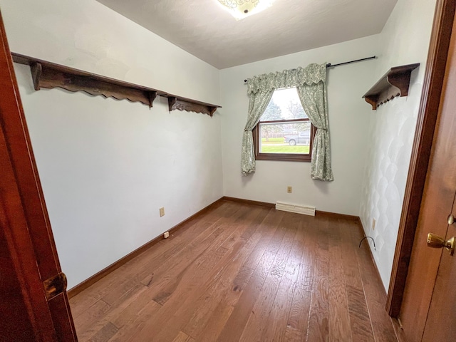 unfurnished room featuring hardwood / wood-style flooring