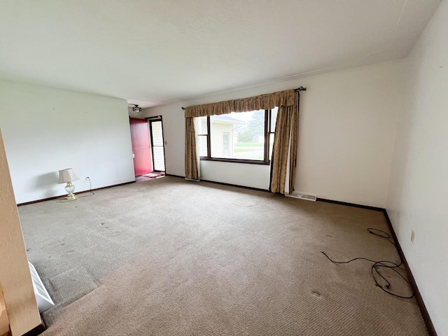 spare room featuring carpet flooring