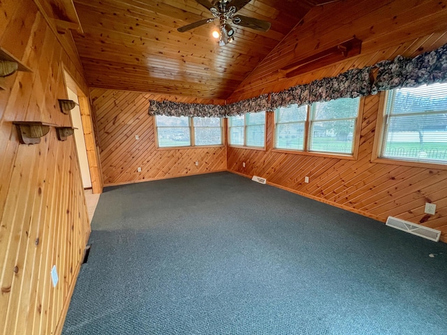 unfurnished sunroom featuring ceiling fan, wooden ceiling, and vaulted ceiling