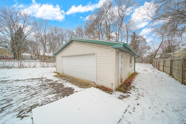 view of snow covered garage