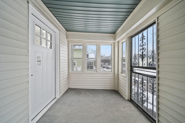 unfurnished sunroom with a healthy amount of sunlight