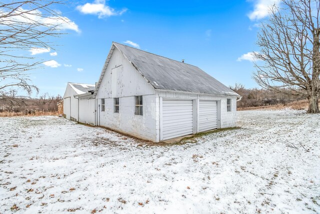 view of snow covered garage