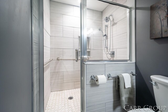 bathroom with toilet and walk in shower