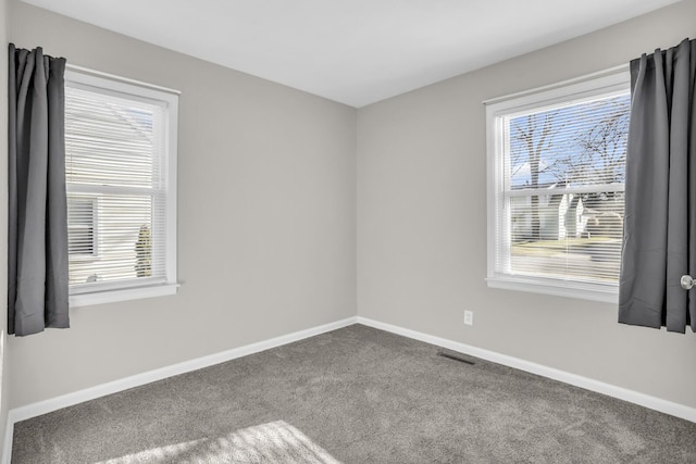 empty room featuring carpet flooring