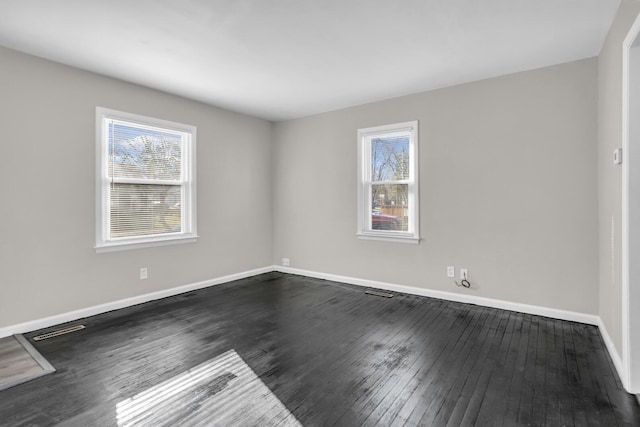 unfurnished room featuring dark hardwood / wood-style floors