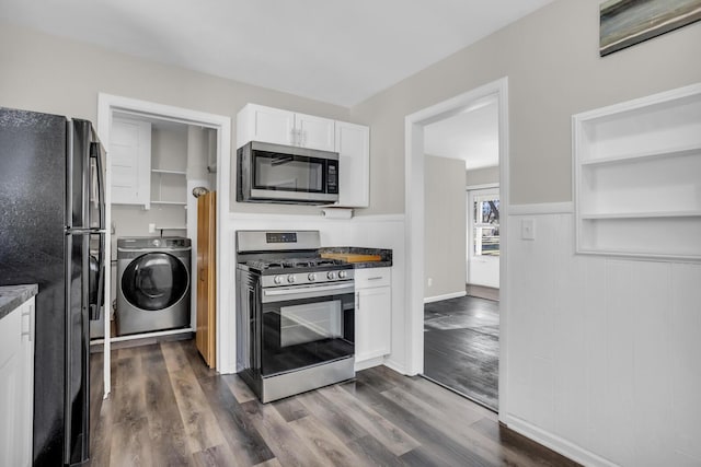 kitchen with white cabinetry, stainless steel appliances, dark hardwood / wood-style floors, and washer / dryer