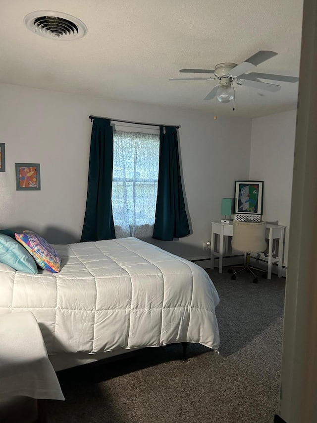 bedroom with ceiling fan, a textured ceiling, and carpet floors