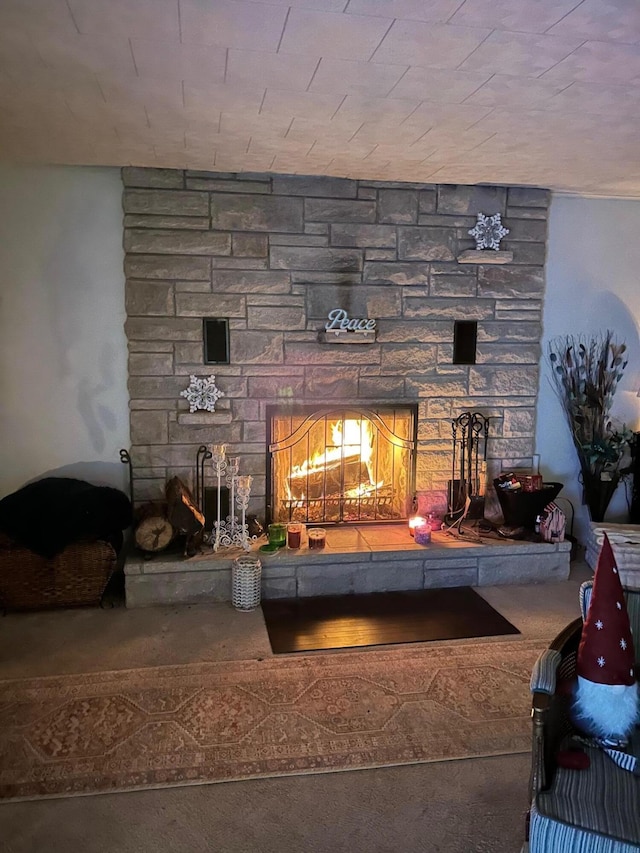 interior details featuring a stone fireplace