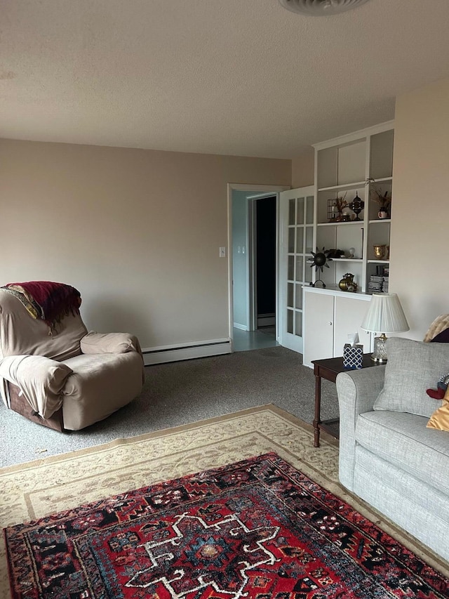 living room with baseboard heating and a textured ceiling