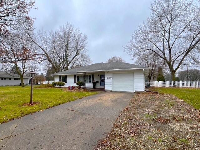 single story home featuring a front lawn and a garage