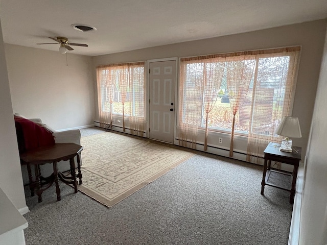 interior space with ceiling fan