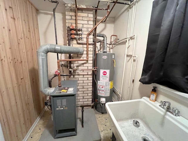 utility room with sink and gas water heater