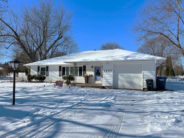 ranch-style house featuring a garage