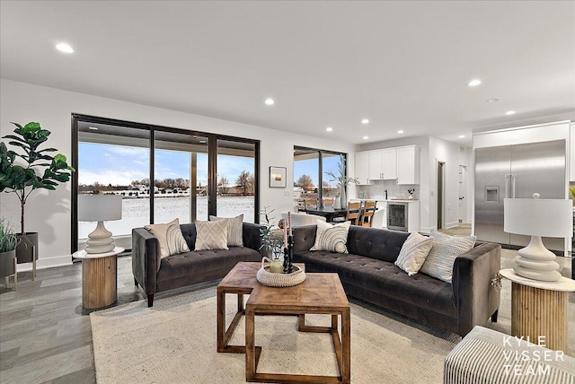 living room featuring light wood-type flooring and wine cooler