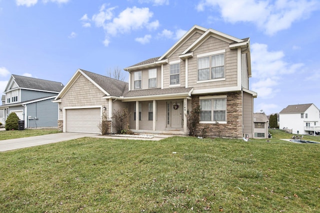 view of front facade featuring a front lawn, a porch, and a garage