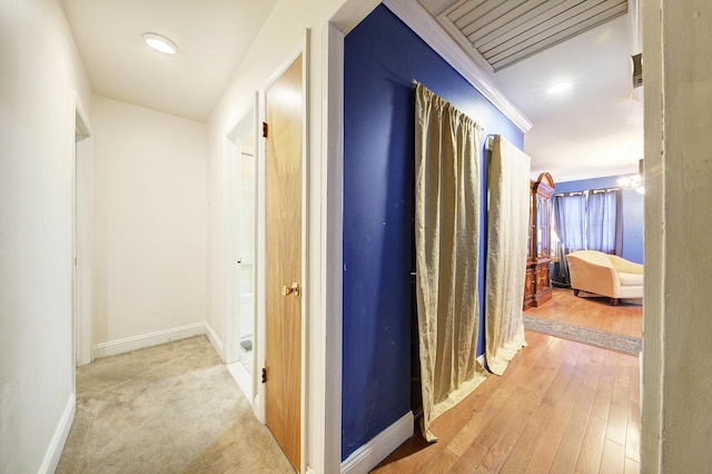 corridor with light hardwood / wood-style flooring