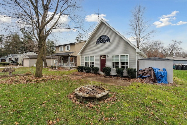 view of front of property with a garage, covered porch, and a front lawn