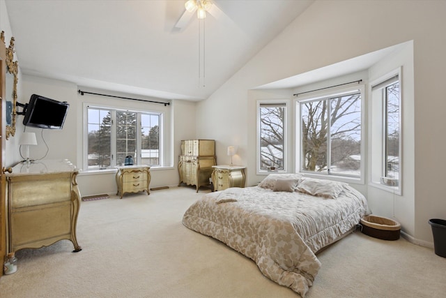 carpeted bedroom with ceiling fan and lofted ceiling